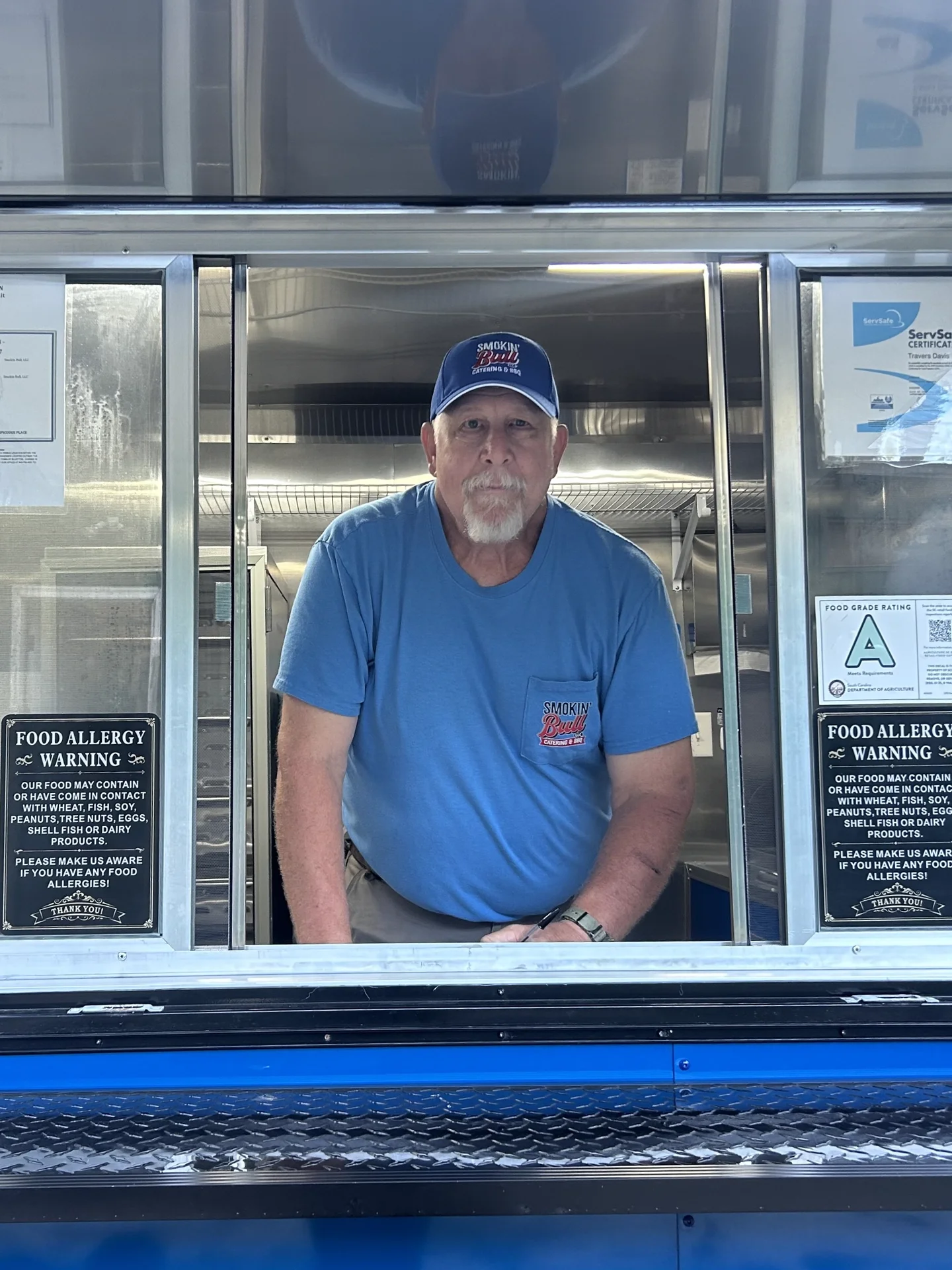 Travers, owner and pitmaster of Smokin' Bull Catering & BBQ